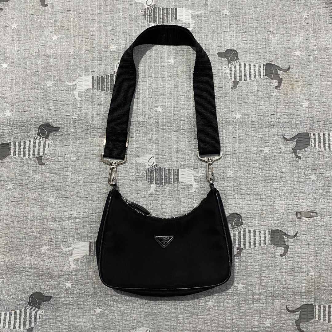 Prada Mini Tessuto Nylon Bag (Category: Luxury Bags & Wallets) located in Antipolo. Submitted by bentakahitanoano (Listing ID 1433684168, Image 1). Description: Prada Re-Edition Mini Nylon Bag Still in good condition. A coveted piece from the Re-Edition series, featuring Prada’s signature durable nylon fabric and the iconic triangular logo. A perfect blend of nostalgia and modern utility. Mini Shoulder Kili Kili Bag Condition. Good used condition