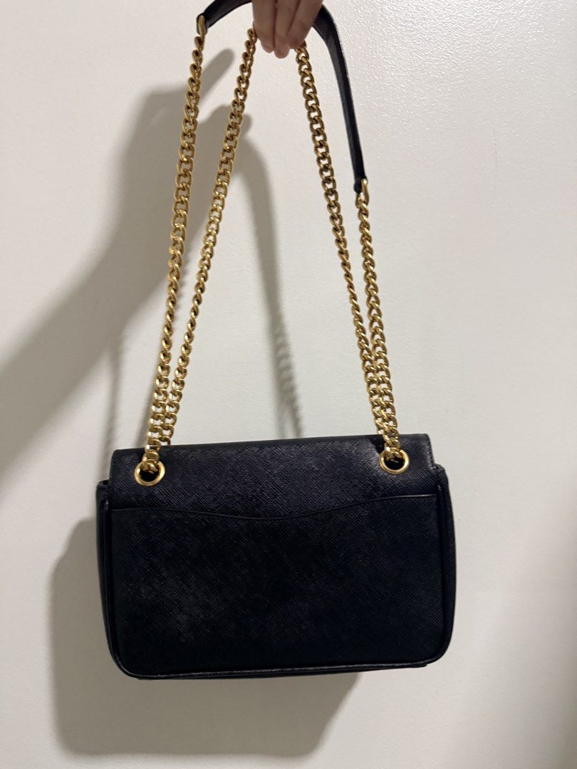 Prada Saffiano crossbody Chain Bag (Category: Luxury Bags & Wallets) located in Quezon City. Submitted by 0628_ (Listing ID 1433642746, Image 2). Description: - Authentic Prada Saffiano Cross body Chain Bag - Gold-tone hardware - Chain strap with leather shoulder rest - Interior: Zippered pocket, Prada logo lining - Includes: Authenticity cards, dust bag - Magnetic snap closure Flaws: minor creasing Rfs: decluttering.