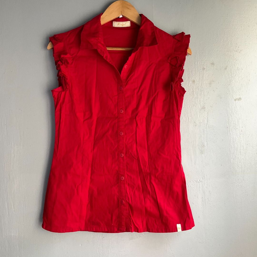 REDGIRL | Crimson Ruffle-Sleeve Button-Up (Category: Blouses) located in Cagayan de Oro. Submitted by random_thrift.av (Listing ID 1433644087, Image 2). Description: size: Small -Semi Medium ◇Dim: W17 L25 ◇ Unique feminine ruffle detailing along the armholes for a modern sleeveless twist ◇ Full button-down front with a classic collar ◇ Due to brightness, lighting or other factors, the color of the actual product can be slightly different from the