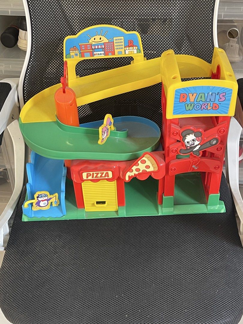 Ryan's World Pizza Playset (Category: Kids Toys) located in Taguig. Submitted by supplementary (Listing ID 1433679773, Image 1). Description: - Ryan's World Pizza Shop Playset - Features a slide and ramp - Includes a character figure - Comes with a pizza slice detail - Bright and colorful design - Features the Ryan's World logo - Perfect for kids!.