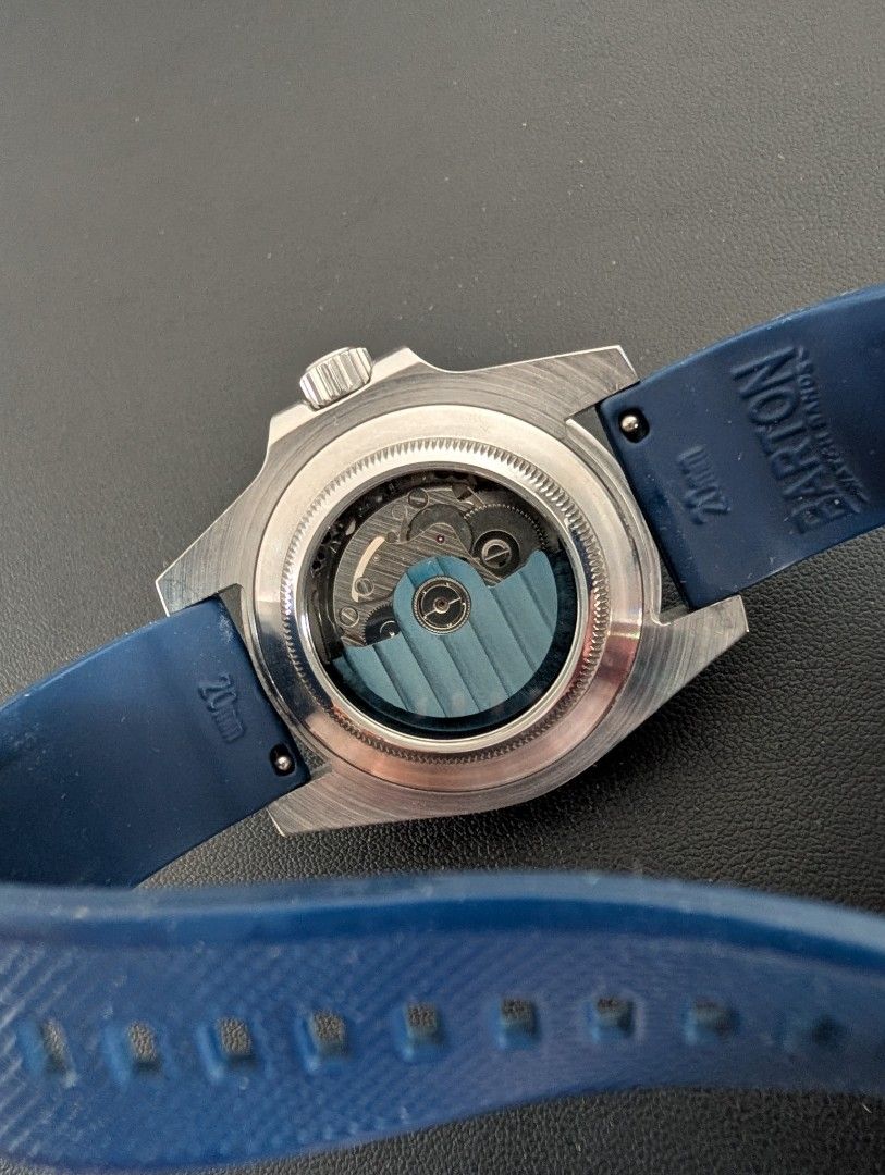 Seiko Mod (Category: Men's Watches) located in Las Pinas. Submitted by carl000000 (Listing ID 1433620688, Image 2). Description: Seiko Submariner Mod Movement: Seiko NH36 Case Diameter: 40mm Strap: 20mm Barton Rubber Strap (will include original metal strap) Sapphire Crystal Additional mod: Exhibition case back and blue rotor.