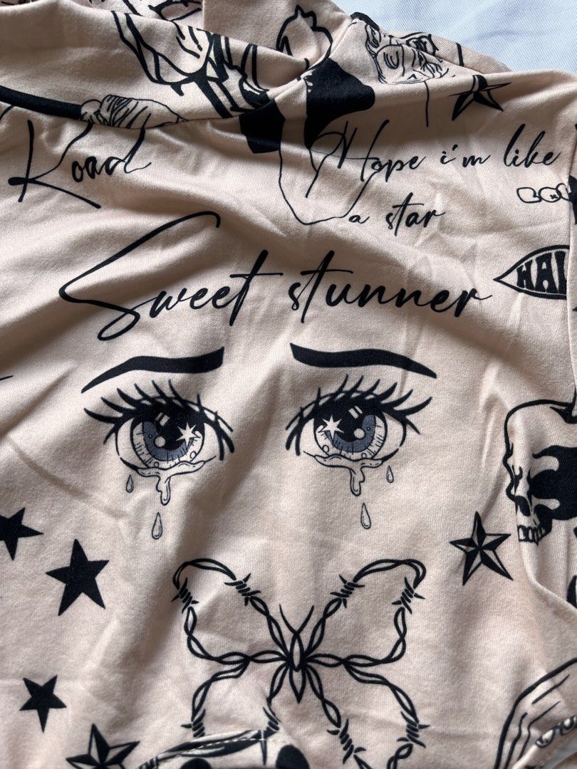 Shein Tattoo Print Crop Top (Category: Others Tops) located in Las Pinas. Submitted by nixxxxx (Listing ID 1433672567, Image 3). Description: - Shein crop top - Used once - Unique tattoo print design - Long sleeves - Mock neck - Beige color with black tattoo graphics.