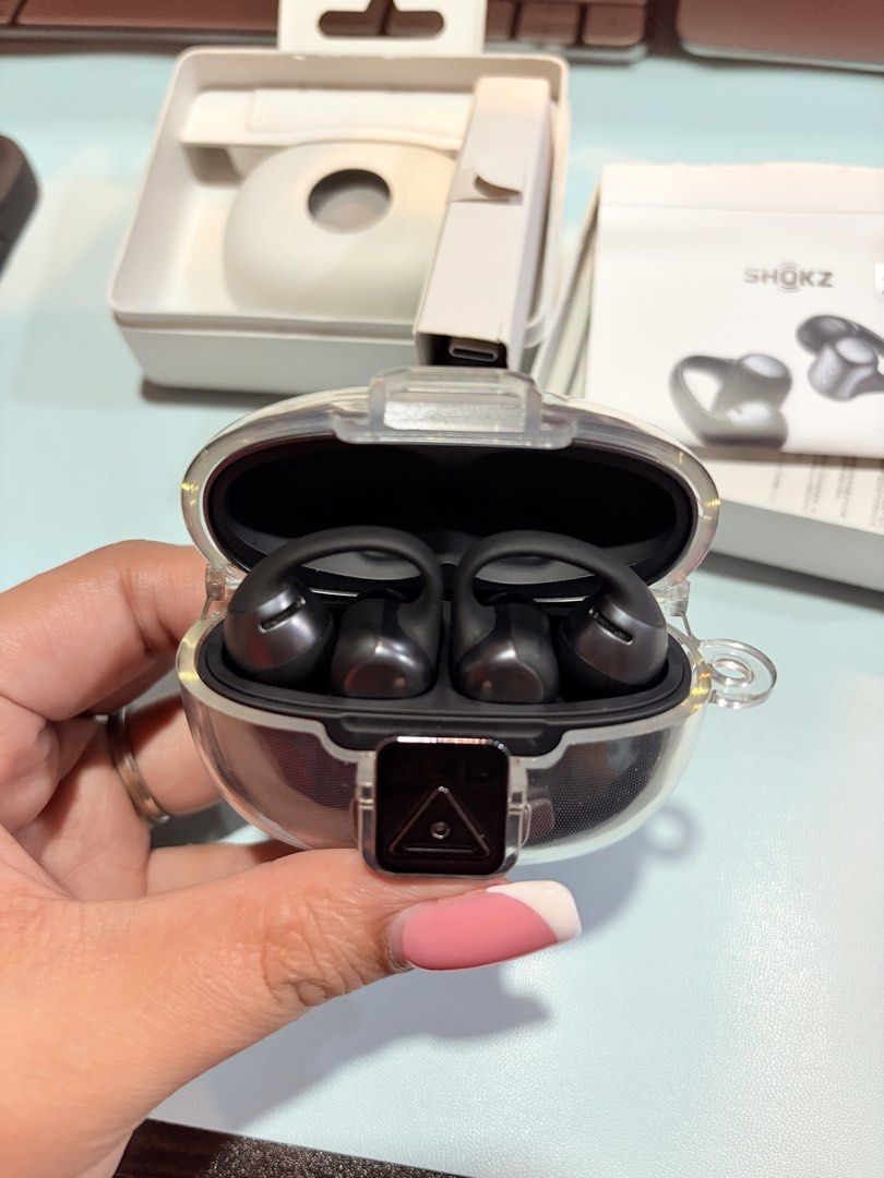 Shokz OpenFit Earbuds - Black (Category: Earphones) located in Makati City. Submitted by krissydg (Listing ID 1433730653, Image 2). Description: - Shokz OpenFit earbuds (Black) - Includes charging case, charging cable, and documentation - 2-year warranty - Original receipt included.