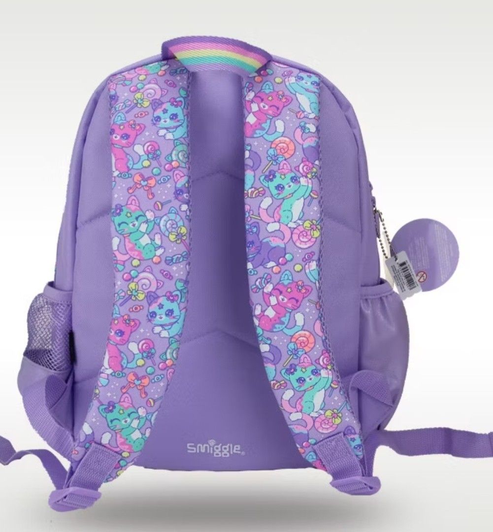 Smiggle Cat Gumball Backpack ORIGINAL from Australia (Category: Backpacks) located in Bacoor. Submitted by ourpersonalstuffs (Listing ID 1433782500, Image 3). Description: - Smiggle backpack with a playful cat and gumball machine design. - Large main compartment for books and essentials. -Carry all - Front pocket with a clear window. - Convenient side pockets for water bottles. - Padded straps and back panel for comfortable wear. - Eye-catching p