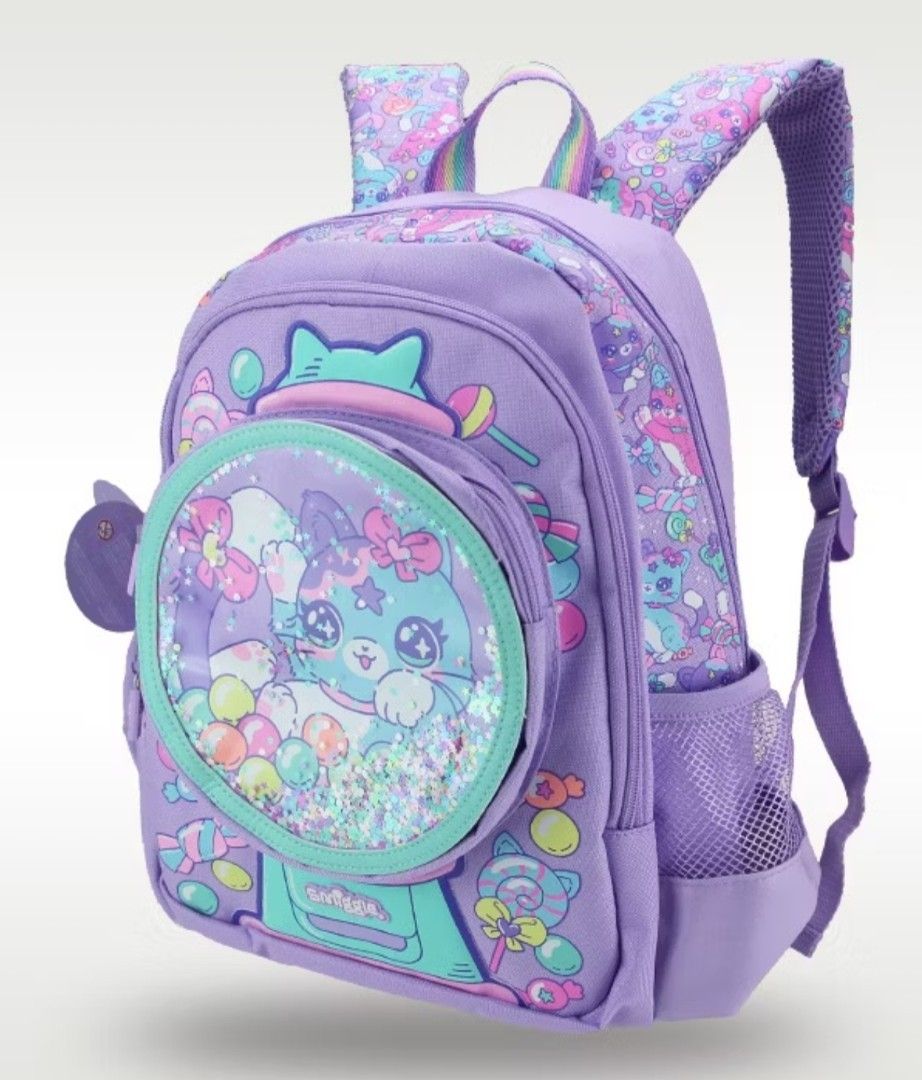 Smiggle Cat Gumball Backpack ORIGINAL from Australia (Category: Backpacks) located in Bacoor. Submitted by ourpersonalstuffs (Listing ID 1433782500, Image 2). Description: - Smiggle backpack with a playful cat and gumball machine design. - Large main compartment for books and essentials. -Carry all - Front pocket with a clear window. - Convenient side pockets for water bottles. - Padded straps and back panel for comfortable wear. - Eye-catching p