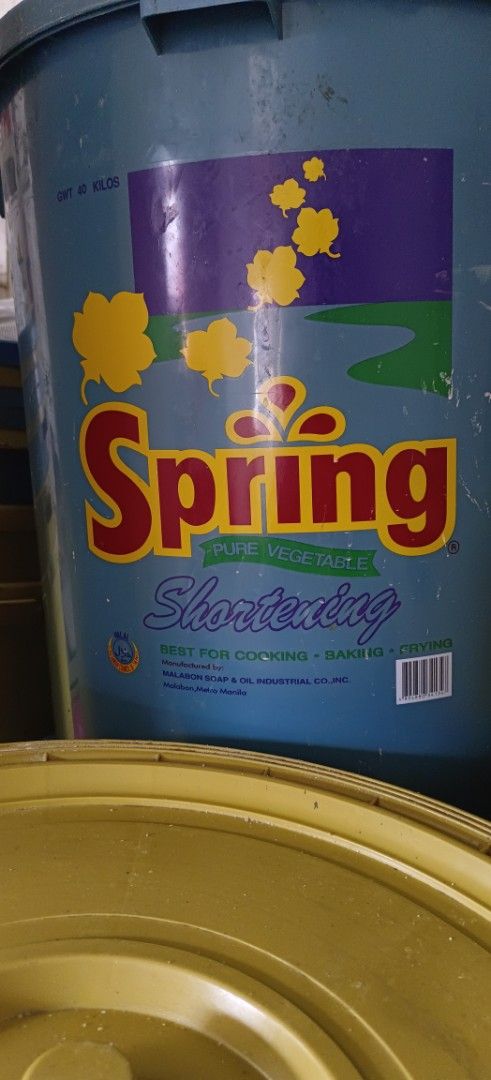 Spring Margarine/Shortening Buckets (Category: Shorts) located in Caloocan City. Submitted by clarocoraz12465 (Listing ID 1433719741, Image 2). Description: - Used plastic buckets - Yellow and blue colors - 'Spring' brand logo - Some buckets include lids - Suitable for storage and various uses.
