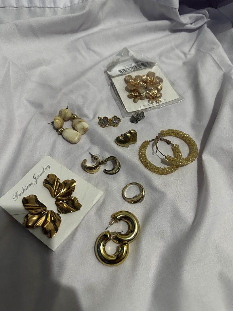 Take all for 150 only!! (Category: Earrings) located in Pasay City. Submitted by j9declutter (Listing ID 1433719240, Image 1). Description: Decluttering! Selling low!!! Pick-up via grab/move it/joyride/angkas/lalamove. Meet-up location: Lrt Edsa station NO COD! If in doubt, wag bumili 😁 You can pay thru BPi & Gcash only. Happy shopping! ❤️❤️❤️ - Gold-toned earring and accessory collection. - Features: - Large flower earrings - Hoop earrings - St