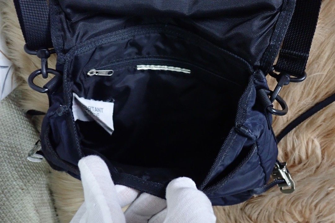 Tough Jeans Inc. Messenger Bag Set (Category: Sling Bags) located in Quezon City. Submitted by edwinvuru (Listing ID 1433589728, Image 2). Description: - Set of three Tough Jeans Inc. messenger bags - Color: Navy Blue - Sizes: Three different sizes included - Features: - Adjustable shoulder straps - Multiple compartments - Tough Jeans Inc. branding - Unique design with white zipper pulls and metal hardware - Interior: - Small pocket - Tag with im