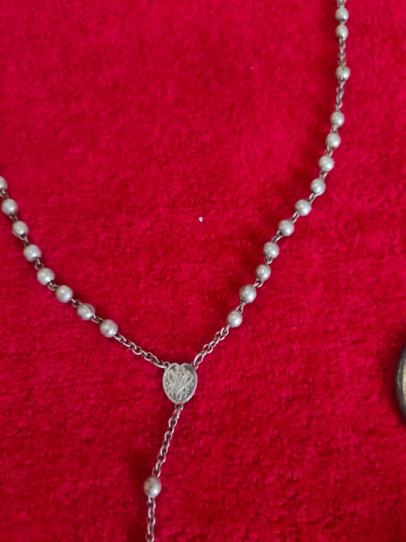 Vintage Rosary with Cross (Category: Religious Items) located in Imus. Submitted by jane369 (Listing ID 1433613544, Image 3). Description: - Vintage silver rosary - Features a detailed cross pendant - Small, round beads - Includes a small container - Ideal for personal use or collection -made in Italy (embossed in the cross) Marian Monogram the interwined letters A and M short for Ave Maria (Hail Mary) or Maria for the Virgin Mary It is very old,