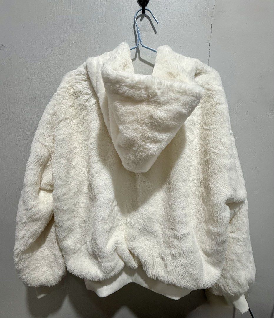 White Fur Hooded Fleece Jacket (Plus-size) (Category: Coats, Jackets and Outerwear) located in San Pedro. Submitted by me-shops (Listing ID 1433695619, Image 2). Description: White faux fur jacket Size: Fits XXL - Hooded - Full zip closure - Soft, fluffy texture - Satin-like lining - Bomber-style hem and cuffs - Warm and suitable for cooler weather.