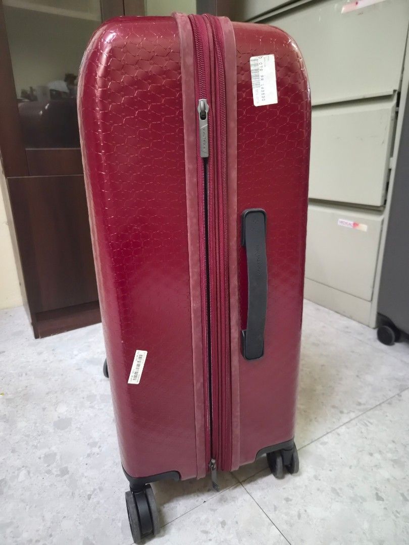 World Traveller - Berry Red Suitcase (Medium) (Category: Luggage) located in Las Pinas. Submitted by ajbash (Listing ID 1433665837, Image 3). Description: - 8/10 condition -Medium size - signs of sticker marks Width 18 inches Length 25.5 inches Thickness 11 inches -Sign of usage.