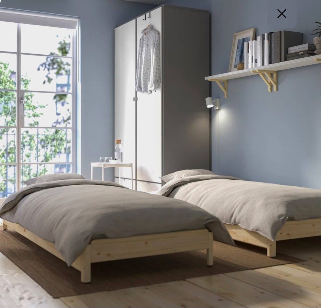 X2 stackable bed frames with mattresses (Category: Bed Frames & Mattresses) located in Singapore. Submitted by frenchymila (Listing ID 1433727353, Image 3). Description: Pick up 399939 - Converts to single or double bed - Made of solid wood - Sturdy and stylish design - Perfect for guest rooms or small spaces - Mattress not included $150 each (including mattress).