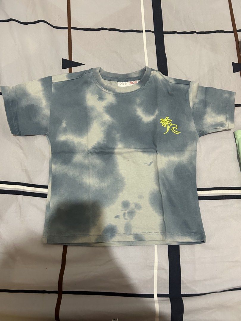 Zara Tie-dye Summer Waves Tshirt Kids (Category: Babies & Kids Fashion) located in Quezon City. Submitted by wonderrv18 (Listing ID 1433673811, Image 1). Description: - Zara tie-dye t-shirt - Unique palm tree and wave graphic - Back graphic: "Here comes the summer waves - California surf school" - Short sleeves - Crew neck - Ideal for a casual, summery look.