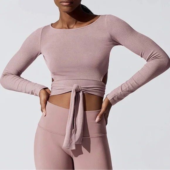 Alo yoga barre long sleeve crop top mauve pink (Category: Activewear) located in Singapore. Submitted by chairman.meow (Listing ID 1433957204, Image 1). Description: No trades Tracked mail $2 or pick up Potong Pasir Size S stretchable Adjustable self tie detail Good condition no defects .