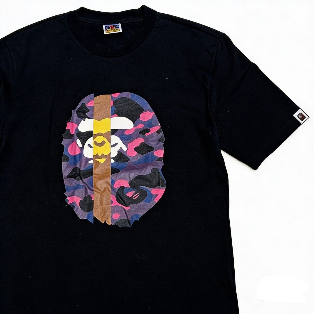 BAPE Camo Graphic T-shirt (Category: Tshirts & Polo Shirts ) located in Bulacan. Submitted by rb_smn (Listing ID 1433879546, Image 1). Description: - Black BAPE T-shirt - Features a vibrant camo graphic - Classic crew neck design - Comfortable, soft material - Authentic BAPE tag.