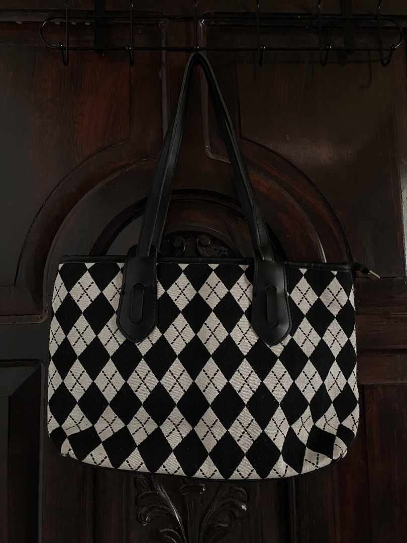 Black and White Argyle Tote Bag School Bag (Category: Tote Bags) located in Iloilo. Submitted by cbd222 (Listing ID 1433813362, Image 2). Description: - Classic black and white argyle pattern - Black leather handles and trim - Rectangular shape with zipper closure - Medium size, ideal for daily use - Simple and elegant design.