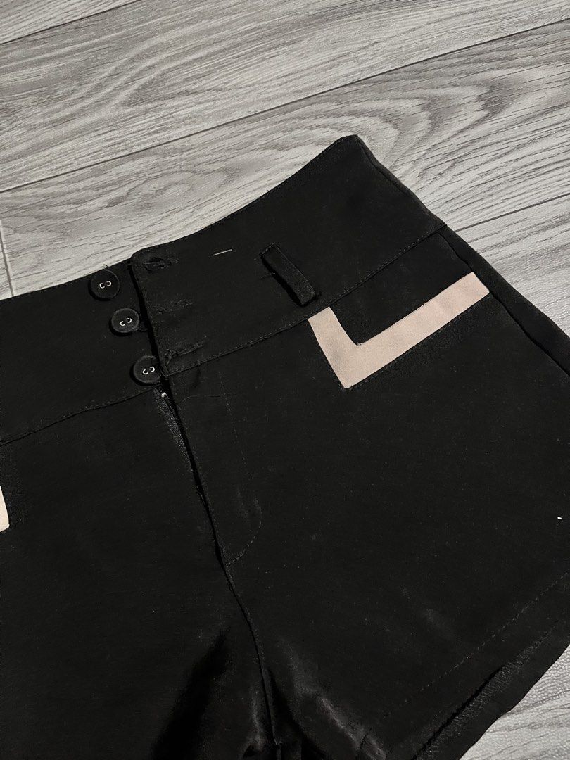 Black High-Waisted Shorts with Contrast Pockets (Category: Shorts) located in Pasig City. Submitted by anya2000 (Listing ID 1433903625, Image 2). Description: - Stylish black high-waisted shorts - Flattering design - Button closure - Two front pockets with light-colored trim - Smooth, satin-like fabric - Perfect for a chic and versatile look.