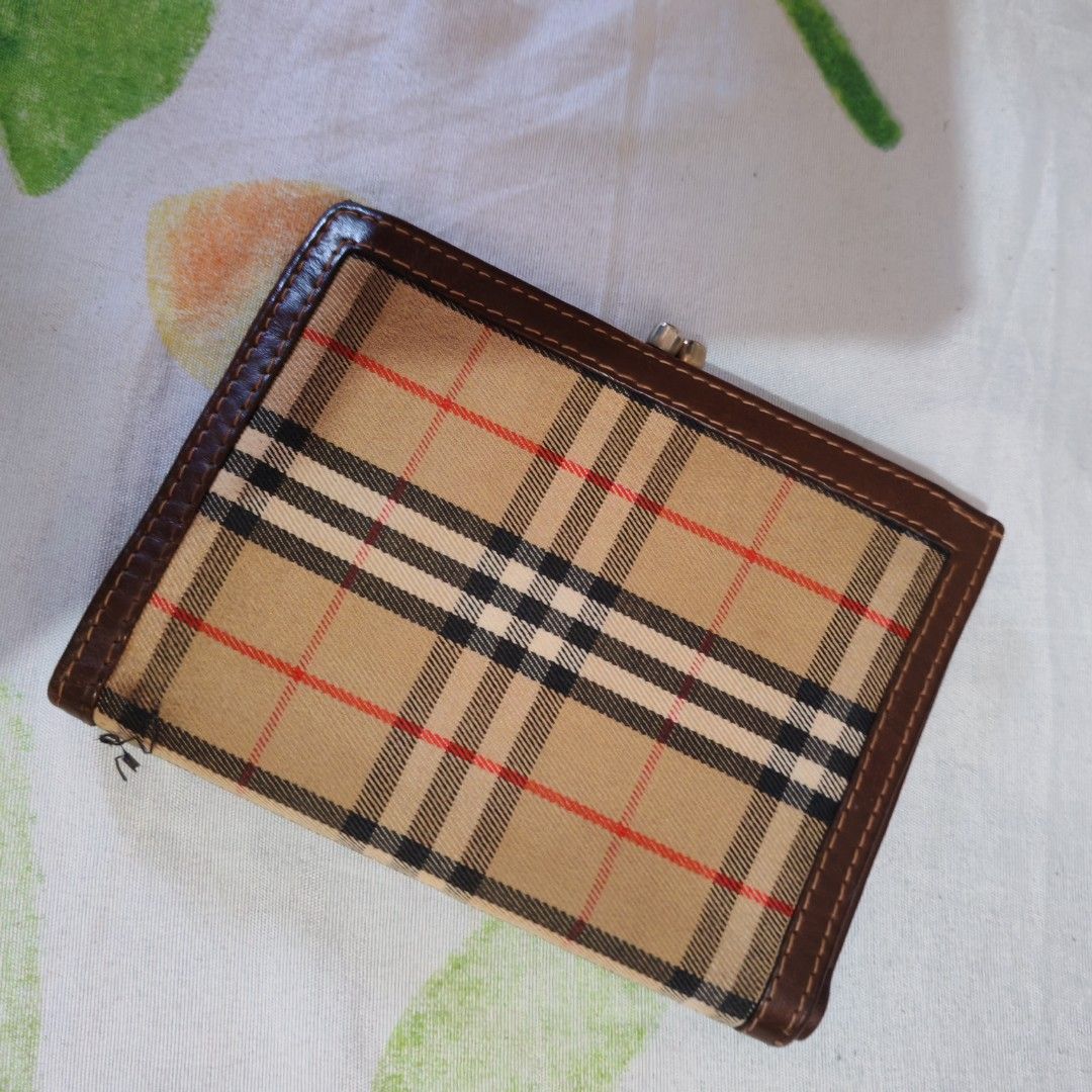 Burberry Checkered Wallet (Category: Luxury Bags & Wallets) located in Paranaque City. Submitted by princessitems (Listing ID 1433829643, Image 3). Description: - Authentic Burberry wallet - Iconic checkered pattern - Brown leather exterior - Snap closure - Multiple card and cash compartments - Classic design - Gold-tone clasp.