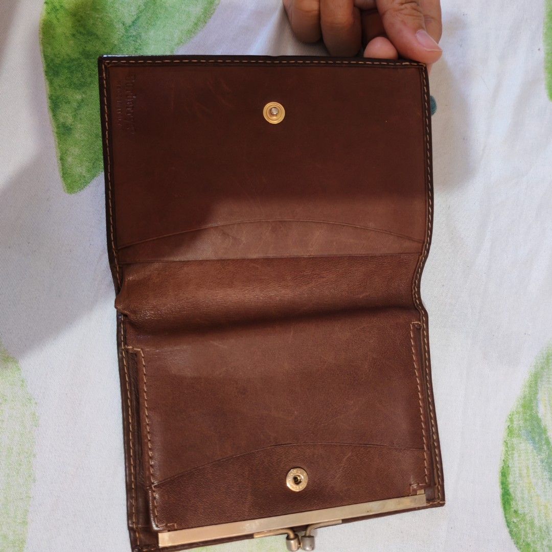 Burberry Checkered Wallet (Category: Luxury Bags & Wallets) located in Paranaque City. Submitted by princessitems (Listing ID 1433829643, Image 2). Description: - Authentic Burberry wallet - Iconic checkered pattern - Brown leather exterior - Snap closure - Multiple card and cash compartments - Classic design - Gold-tone clasp.