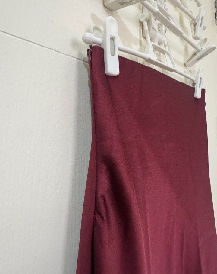 Burgundy Satin Maxi Skirt (Category: Skirts) located in Quezon City. Submitted by mmangoes (Listing ID 1433824507, Image 2). Description: - bought from Frankie's General Store in Rockwell - waist: 12.5-13 inches; length: 35.5 inches - straight silhouette - zipper closure; garterized but garter not visible.