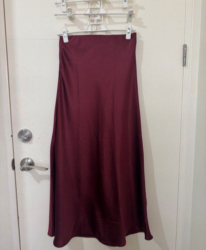 Burgundy Satin Maxi Skirt (Category: Skirts) located in Quezon City. Submitted by mmangoes (Listing ID 1433824507, Image 1). Description: - bought from Frankie's General Store in Rockwell - waist: 12.5-13 inches; length: 35.5 inches - straight silhouette - zipper closure; garterized but garter not visible.