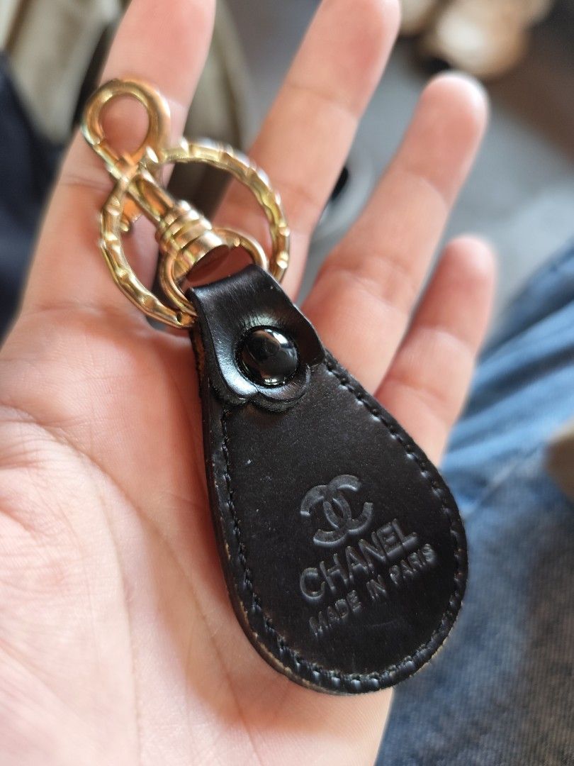 Chanel Keyring (Category: Luxury Accessories) located in Rizal. Submitted by yomanta (Listing ID 1433886078, Image 3). Description: - Chanel keyring - Features black leather tag - Embossed Chanel logo and "Made in Paris" - Gold-tone metal clasp and ring - Perfect for keys or bags.