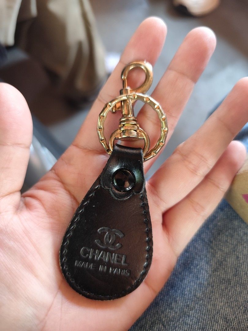 Chanel Keyring (Category: Luxury Accessories) located in Rizal. Submitted by yomanta (Listing ID 1433886078, Image 2). Description: - Chanel keyring - Features black leather tag - Embossed Chanel logo and "Made in Paris" - Gold-tone metal clasp and ring - Perfect for keys or bags.