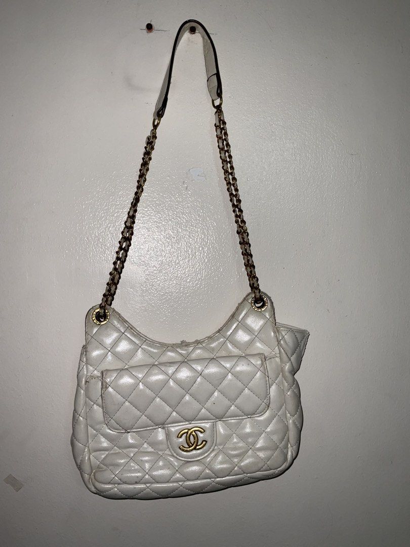 channel (Category: Luxury Bags & Wallets) located in Manila. Submitted by geloreyes262956 (Listing ID 1433939697, Image 3). Description: Chanel Shiny Crumpled Calfskin Quilted Small Wavy CC Hobo bag Price: 1,660 plus shipping negotiable •"unsure on the Authenticity" •Condition: 7/ 10 condition details on the pictures note that the item has minimal leather tear on the handle and the bag itself Color condition:7/ 10 has minimal stains "Sure buyer o