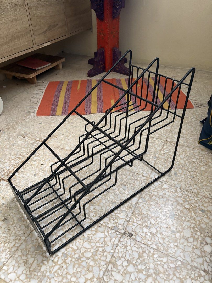 Display Rack (Category: Shelves, Cabinets & Racks) located in Kuala Lumpur. Submitted by bolt12_ (Listing ID 1433850511, Image 2). Description: - Black metal display rack - Multiple tiered shelves for organized display - Sturdy and suitable for retail or home use - Easy viewing and access to products.