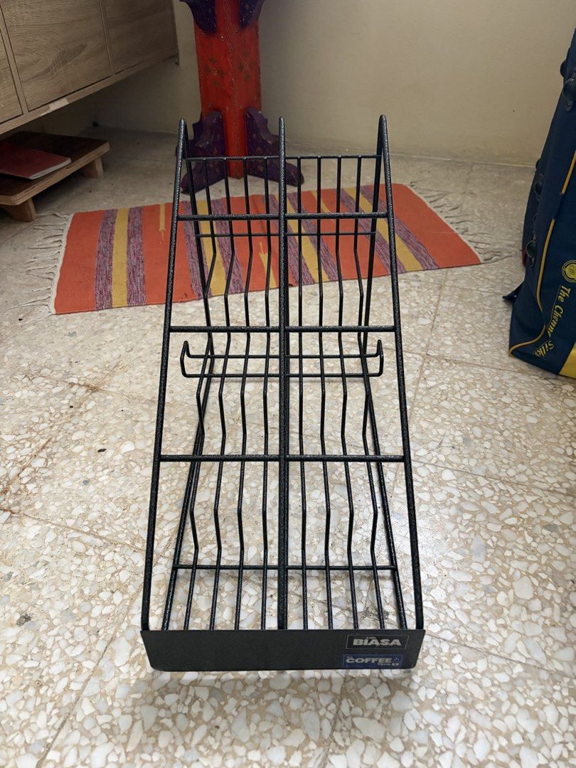 Display Rack (Category: Shelves, Cabinets & Racks) located in Kuala Lumpur. Submitted by bolt12_ (Listing ID 1433850511, Image 1). Description: - Black metal display rack - Multiple tiered shelves for organized display - Sturdy and suitable for retail or home use - Easy viewing and access to products.