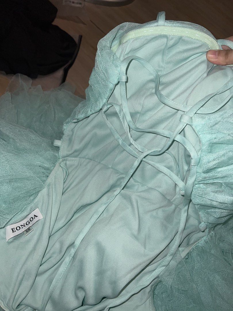 Eongoa Tulle Ruffled Dress (Category: Dresses) located in Pasig City. Submitted by amxene (Listing ID 1433809518, Image 2). Description: - Eongoa maxi dress - Soft teal color - Size: XS - Waist: 20-22 inches - Bust: 28-34 inches - Layered tulle skirt - Lace-up back.