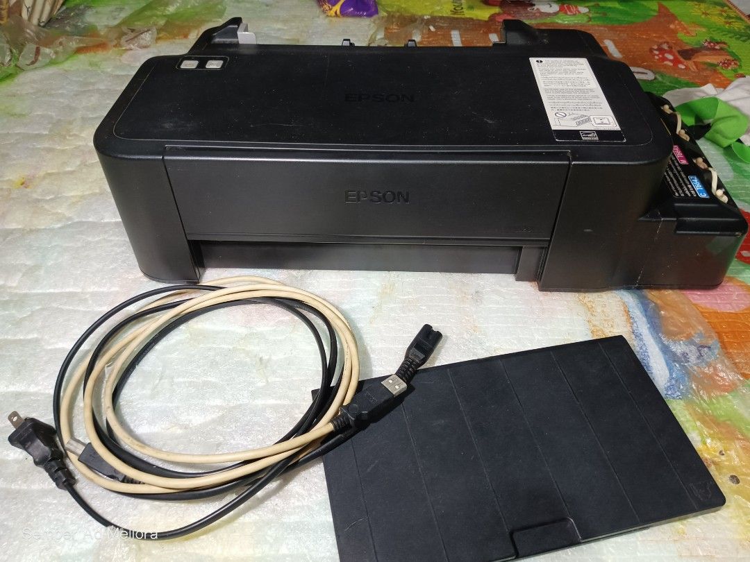 Epson L120 Ink Tank Printer (Category: Printers, Scanners & Copiers) located in Cebu City. Submitted by dura_johncarl (Listing ID 1433969973, Image 2). Description: FOR SALE MY OLD PRINTER •Not been clean •Stacked item •broken Paper Guide Plate •still with ink inside •sometimes power cable won't properly turn on, but the printer itself still functions - Epson L120 ink tank printer - still functions but needs heavy cleaning inside - Includes power