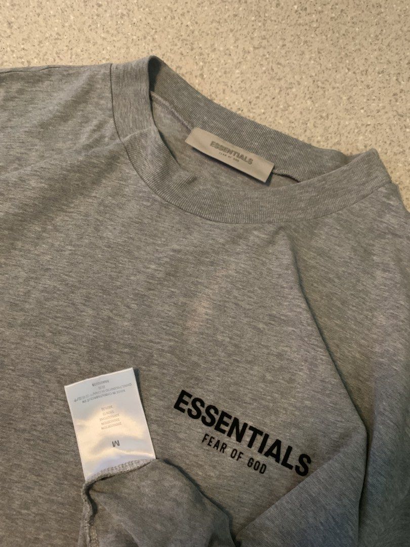 Essentials Fear of God Grey T-shirt (Category: Tshirts & Polo Shirts ) located in Manila. Submitted by condevilla19398 (Listing ID 1433851258, Image 3). Description: - Fear of God Essentials T-shirt - Color: Grey - Size: M - Features the Essentials logo (front and back) - Made with comfortable fabric - Great for everyday wear.