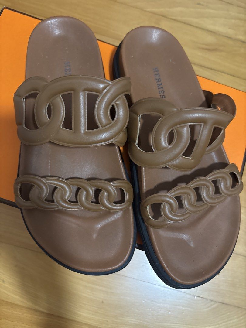Extra Sandles (Category: Sandals) located in Singapore. Submitted by franklint (Listing ID 1433919521, Image 1). Description: For this price pls use common sense - Color: gold - Includes original box and dust bags - Features iconic chain detail - Size: 38-39 Leather sandals .