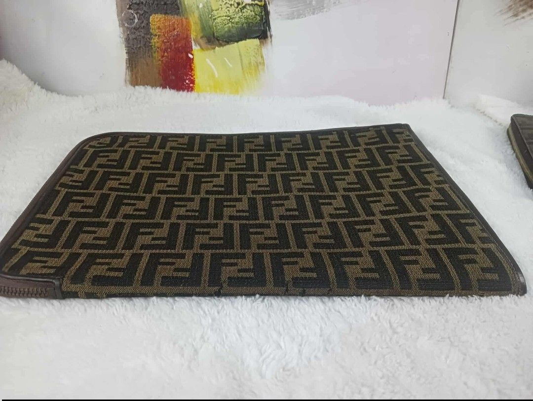 Fendi FF Logo Ipad case (Category: Luxury Bags & Wallets) located in Manila. Submitted by rangya (Listing ID 1433786640, Image 1). Description: - Authentic Fendi clutch - Iconic FF logo pattern - Zip closure - Brown leather trim - Solid brown interior - Made in Italy - Stylish accessory jm.