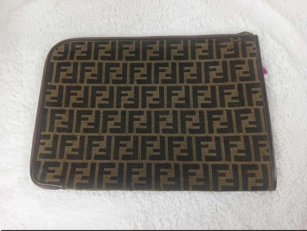 Fendi FF Logo Ipad case (Category: Luxury Bags & Wallets) located in Manila. Submitted by rangya (Listing ID 1433786640, Image 3). Description: - Authentic Fendi clutch - Iconic FF logo pattern - Zip closure - Brown leather trim - Solid brown interior - Made in Italy - Stylish accessory jm.