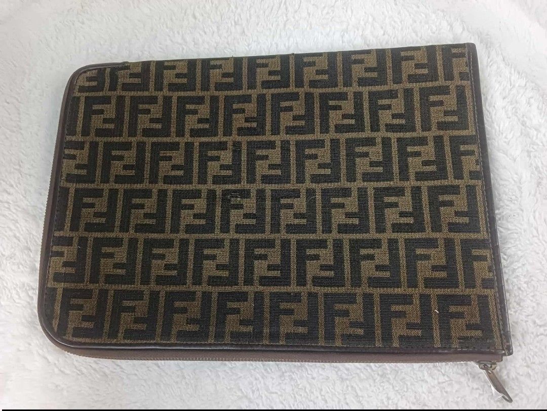 Fendi FF Logo Ipad case (Category: Luxury Bags & Wallets) located in Manila. Submitted by rangya (Listing ID 1433786640, Image 2). Description: - Authentic Fendi clutch - Iconic FF logo pattern - Zip closure - Brown leather trim - Solid brown interior - Made in Italy - Stylish accessory jm.