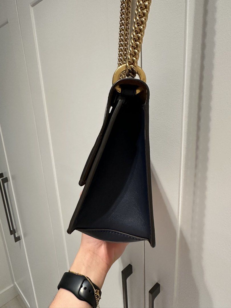 FENDI Kan U Shoulder (Category: Luxury Bags & Wallets) located in Quezon City. Submitted by cailincare94698 (Listing ID 1433837218, Image 2). Description: - Fendi shoulder bag - Navy blue leather - Gold-tone chain strap - FF logo clasp - Multiple card slots - Spacious compartment - Structured silhouette - Luxurious feel - Perfect for any outfit.