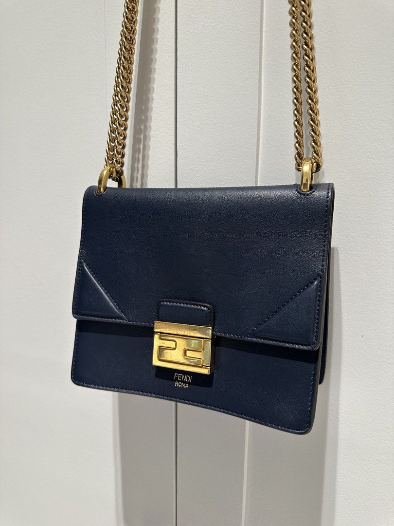 FENDI Kan U Shoulder (Category: Luxury Bags & Wallets) located in Quezon City. Submitted by cailincare94698 (Listing ID 1433837218, Image 1). Description: - Fendi shoulder bag - Navy blue leather - Gold-tone chain strap - FF logo clasp - Multiple card slots - Spacious compartment - Structured silhouette - Luxurious feel - Perfect for any outfit.