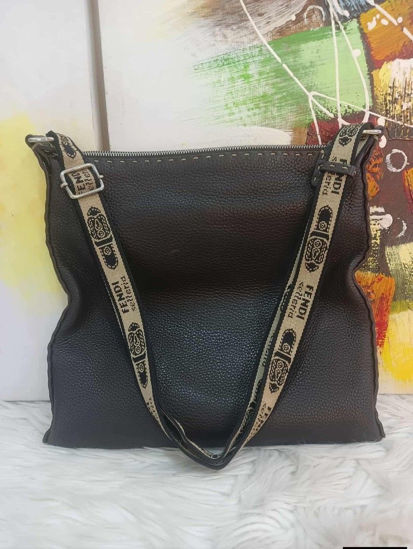 Fendi Selleria Leather Shoulder Bag (Category: Luxury Bags & Wallets) located in Manila. Submitted by rangya (Listing ID 1433786377, Image 2). Description: - Authentic Fendi Selleria shoulder bag - Dark brown leather - Zip closure - Adjustable shoulder strap with Fendi lettering - Fabric-lined interior - Interior pocket with zipper - Metal logo plate - Visible stitching details jm.