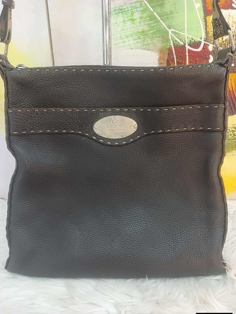 Fendi Selleria Leather Shoulder Bag (Category: Luxury Bags & Wallets) located in Manila. Submitted by rangya (Listing ID 1433786377, Image 1). Description: - Authentic Fendi Selleria shoulder bag - Dark brown leather - Zip closure - Adjustable shoulder strap with Fendi lettering - Fabric-lined interior - Interior pocket with zipper - Metal logo plate - Visible stitching details jm.