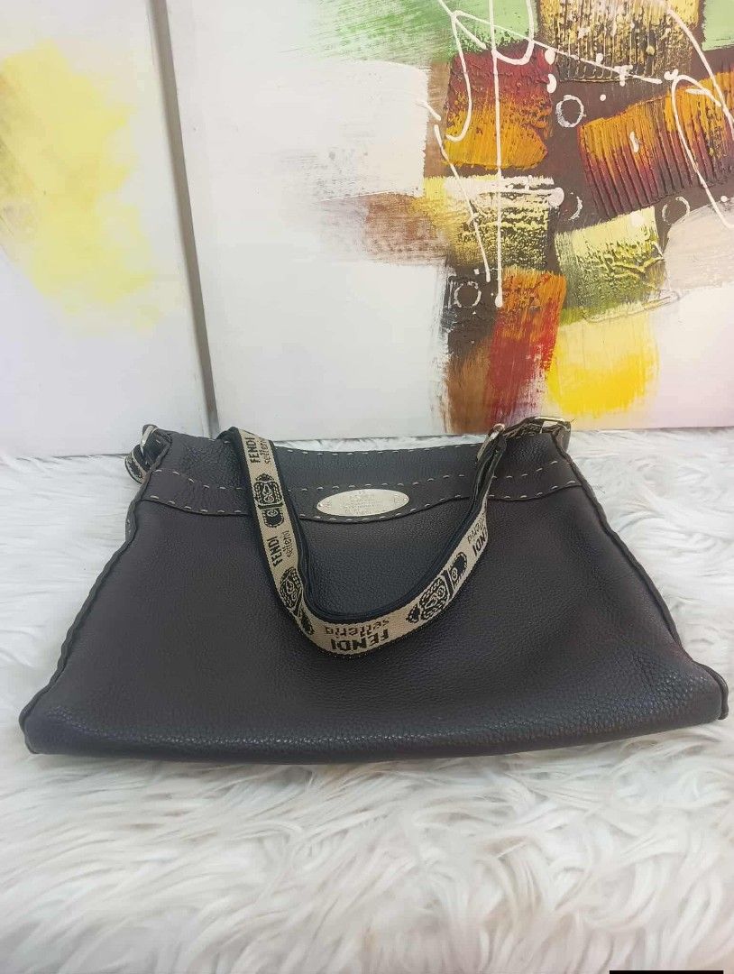 Fendi Selleria Leather Shoulder Bag (Category: Luxury Bags & Wallets) located in Manila. Submitted by rangya (Listing ID 1433786377, Image 3). Description: - Authentic Fendi Selleria shoulder bag - Dark brown leather - Zip closure - Adjustable shoulder strap with Fendi lettering - Fabric-lined interior - Interior pocket with zipper - Metal logo plate - Visible stitching details jm.