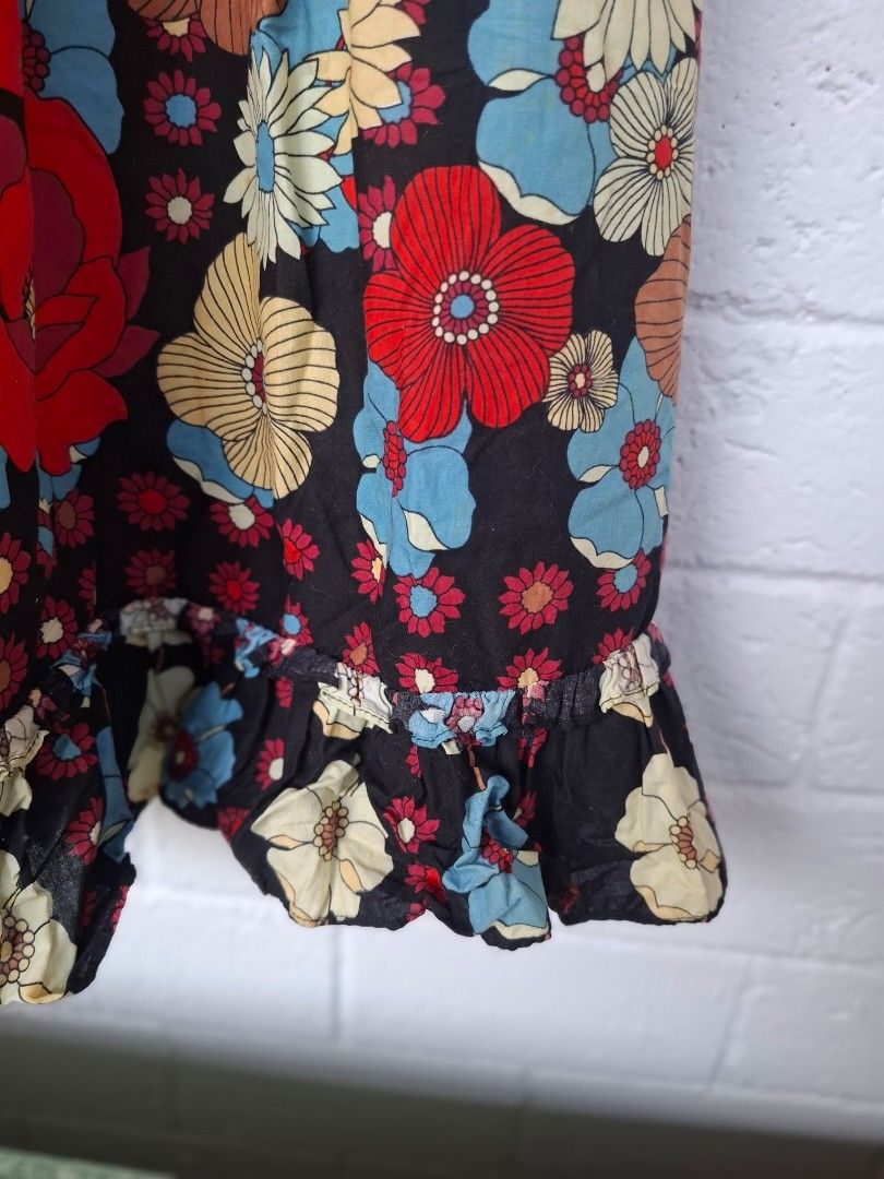 Floral Print Spaghetti Strap Dress (Category: Dresses) located in Pilar. Submitted by missteapot (Listing ID 1433867716, Image 3). Description: - Floral print dress - Black base - Spaghetti straps - Ruffled hem - Fitted bodice - Flowing skirt - White lining - Ideal for casual and summer events.