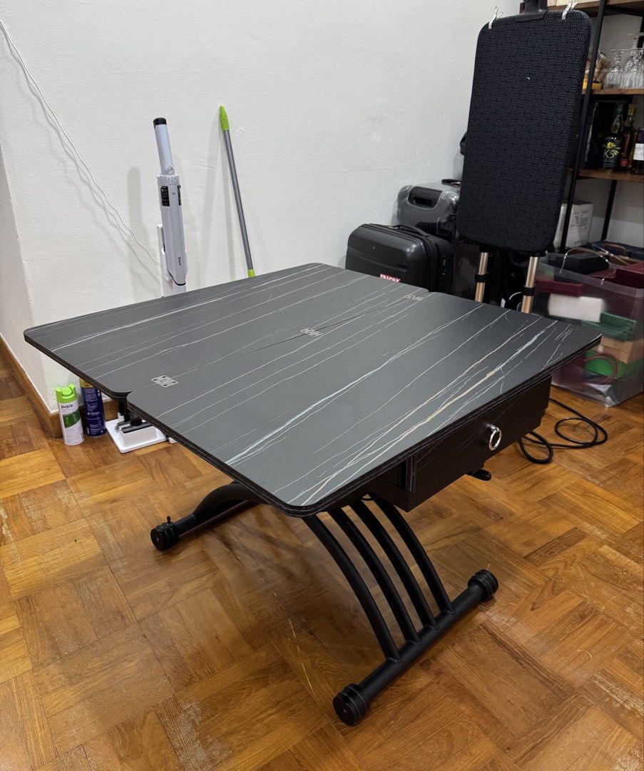 Foldable, Height Adjustable Table (Category: Tables & Sets) located in Singapore. Submitted by bubbbless (Listing ID 1433937579, Image 1). Description: For free. Lightly used, however 1 wheel spoiled. Height adjustable, and foldable, with 2 side drawers. Height 68cm Length 90cm x 90cm (when opened fully) Only for self pick up, please arrange own transport..