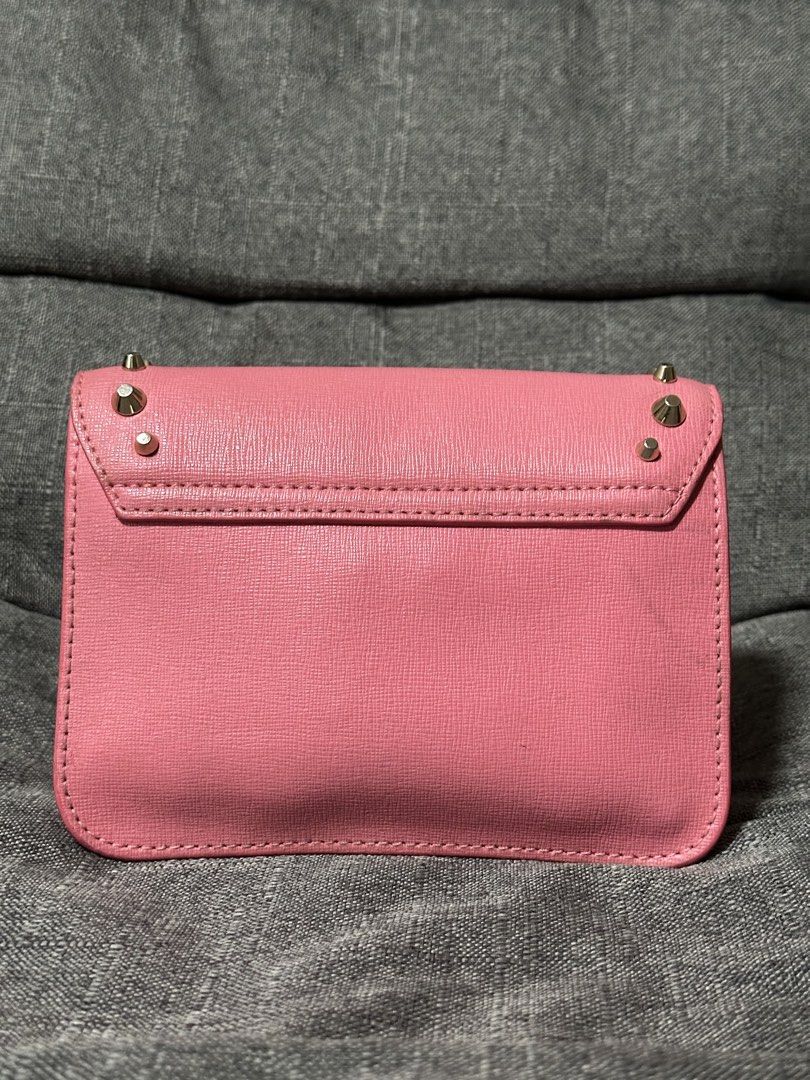 Furla Julia Mini Studded Crossbody Bag (Category: Luxury Bags & Wallets) located in Tarlac. Submitted by wearagainboutique (Listing ID 1433912820, Image 2). Description: - Authentic Furla crossbody bag - Color: Pink - Silver hardware - Studded details - Flap closure with Furla logo - Interior pocket - Chain strap - Made in Bulgaria - Rectangular shape - Textured finish -minimal signs of use -needs cleaning .