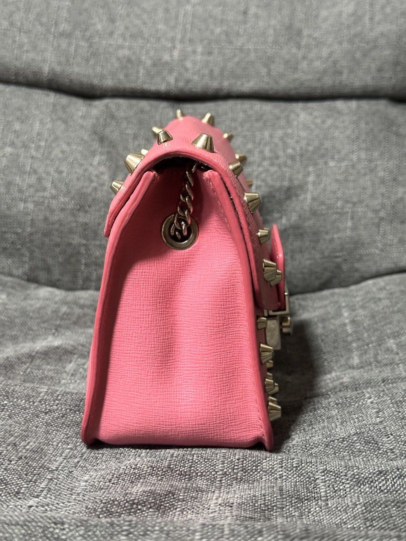 Furla Julia Mini Studded Crossbody Bag (Category: Luxury Bags & Wallets) located in Tarlac. Submitted by wearagainboutique (Listing ID 1433912820, Image 3). Description: - Authentic Furla crossbody bag - Color: Pink - Silver hardware - Studded details - Flap closure with Furla logo - Interior pocket - Chain strap - Made in Bulgaria - Rectangular shape - Textured finish -minimal signs of use -needs cleaning .