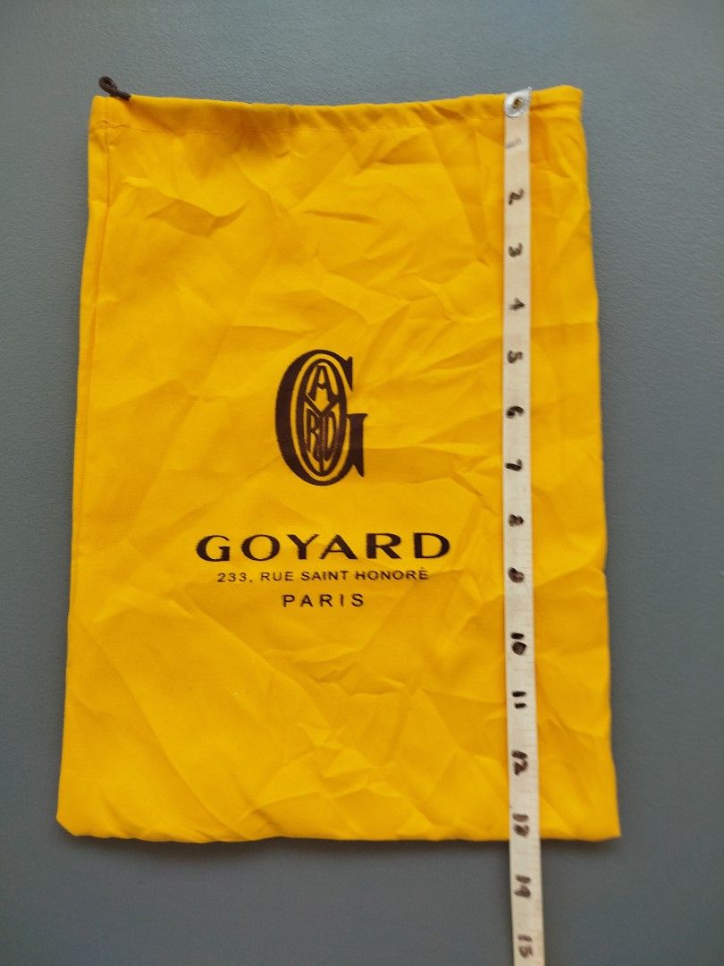 Goyard Dust Bag (Category: Luxury Bags & Wallets) located in Calamba. Submitted by merrymerida (Listing ID 1433825373, Image 2). Description: - Authentic Goyard dust bag - Features Goyard logo and address: 233, Rue Saint Honore, Paris - Color: Yellow - Dimensions: Approximately 11 inches wide x 15 inches tall - Closure: Zipper - Perfect for protecting your Goyard items.
