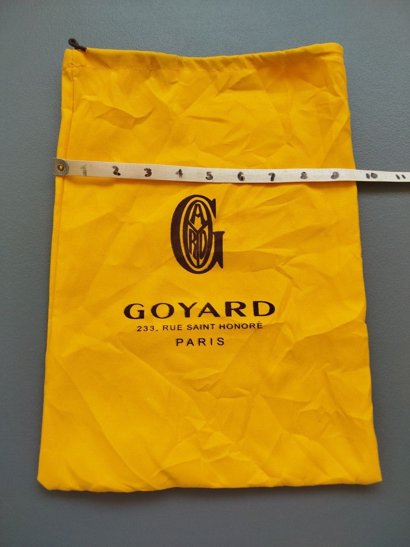 Goyard Dust Bag (Category: Luxury Bags & Wallets) located in Calamba. Submitted by merrymerida (Listing ID 1433825373, Image 1). Description: - Authentic Goyard dust bag - Features Goyard logo and address: 233, Rue Saint Honore, Paris - Color: Yellow - Dimensions: Approximately 11 inches wide x 15 inches tall - Closure: Zipper - Perfect for protecting your Goyard items.