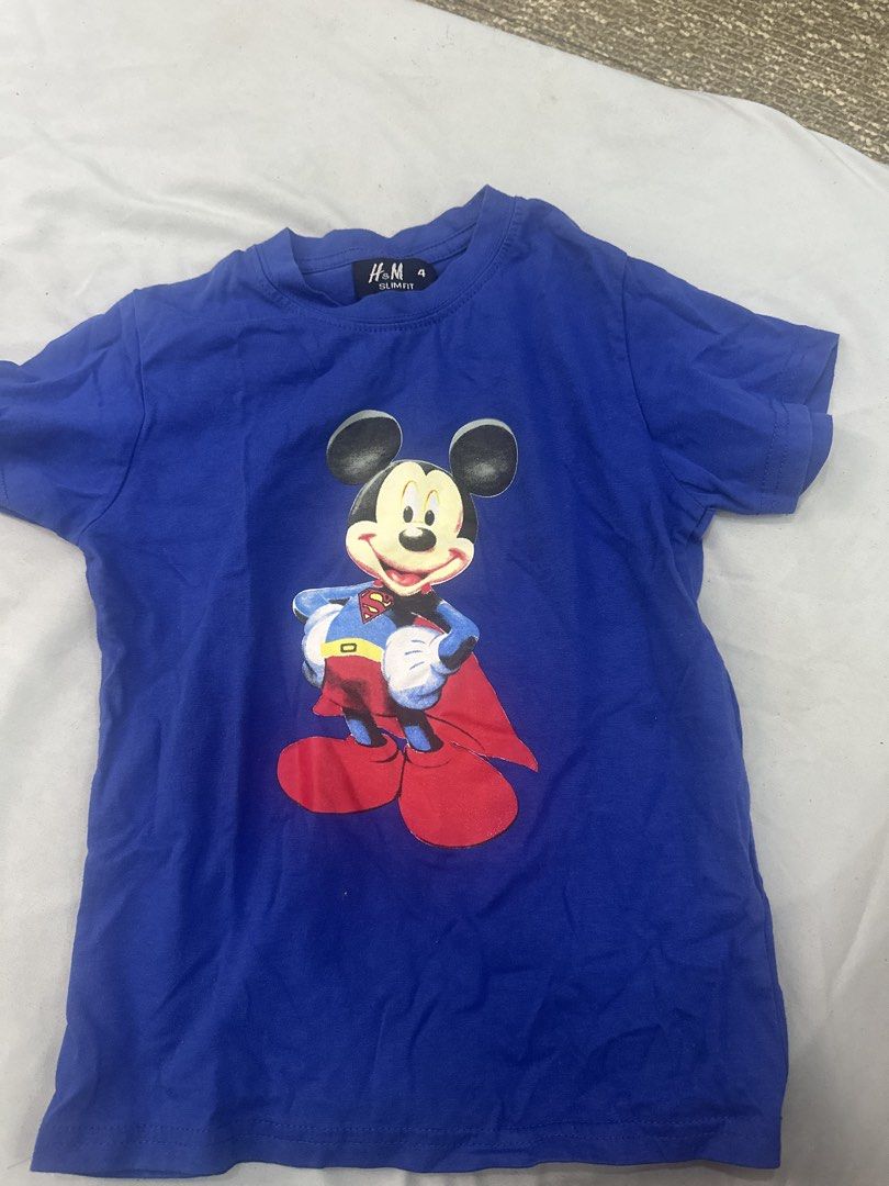 H&M Mickey Mouse Superhero T-shirt (Category: Babies & Kids Fashion) located in Quezon City. Submitted by heyyjaaay (Listing ID 1433800200, Image 1). Description: - H&M t-shirt - Features a Mickey Mouse superhero graphic - Size: 4 - Short sleeves - Round neckline - Soft material - Perfect for young Disney fans!.