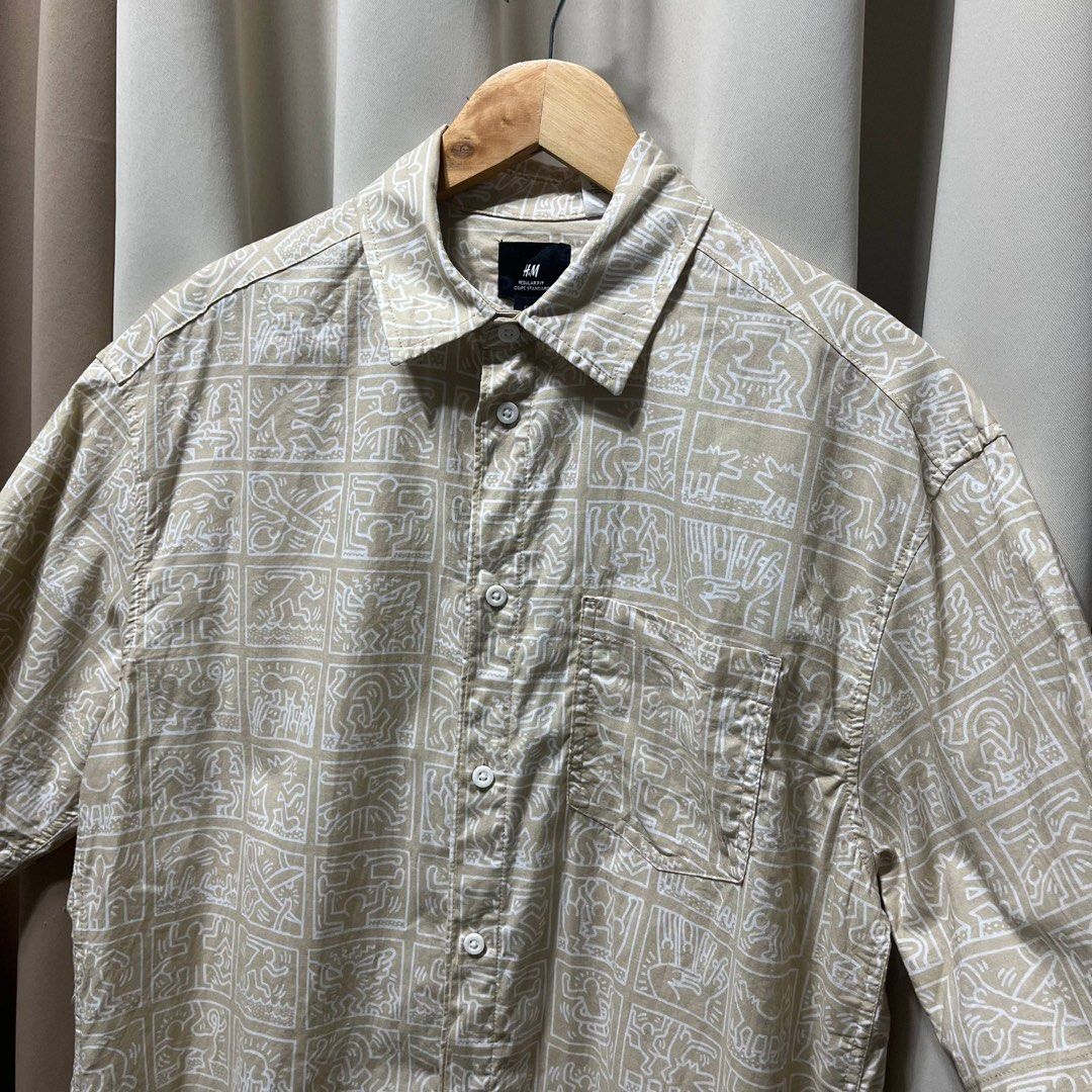 H&M x Keith Haring Beige Short Sleeve (Category: Tshirts & Polo Shirts ) located in Bulacan. Submitted by ishrm (Listing ID 1433878706, Image 2). Description: M-L No Issue Shoulder- 20in Sleeves- 11in Length- 28in Width- 22in MOD: J&T only MOP: GCash (Payment first).